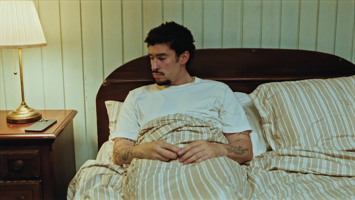 Bad Bunny’s ‘El Clúb’ Video Is A Trippy Case Of FOMO